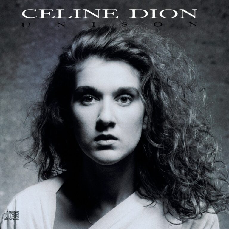 Céline Dion mit lockigem Haar und ernstem Blick auf dem Albumcover von Unison.