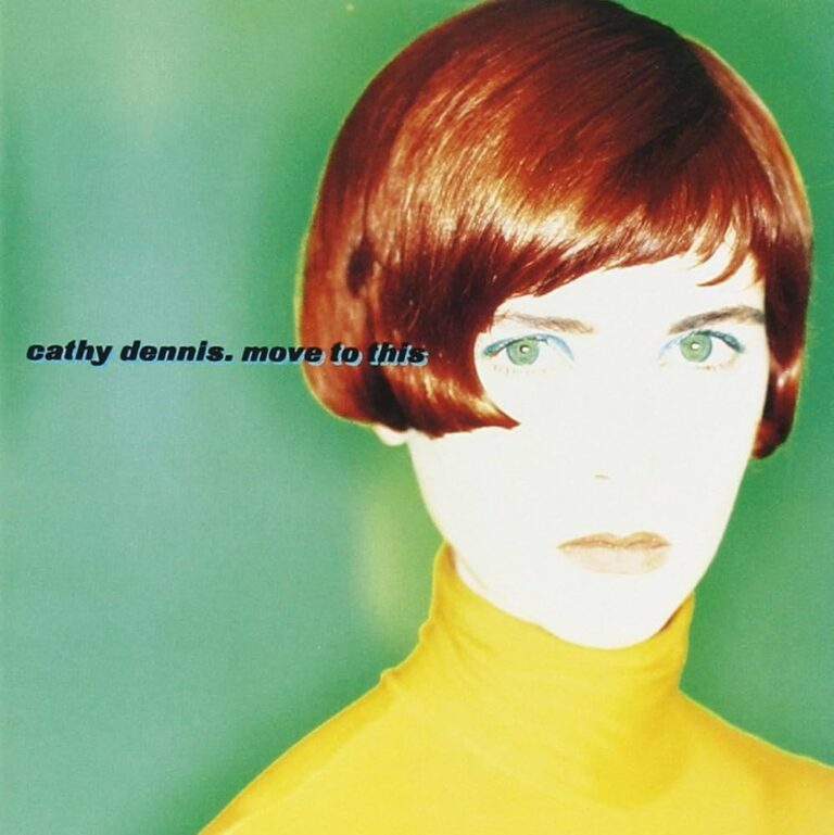 Albumcover von Cathy Dennis mit einer Frau in gelbem Oberteil und rotem Haarschnitt vor grünem Hintergrund.