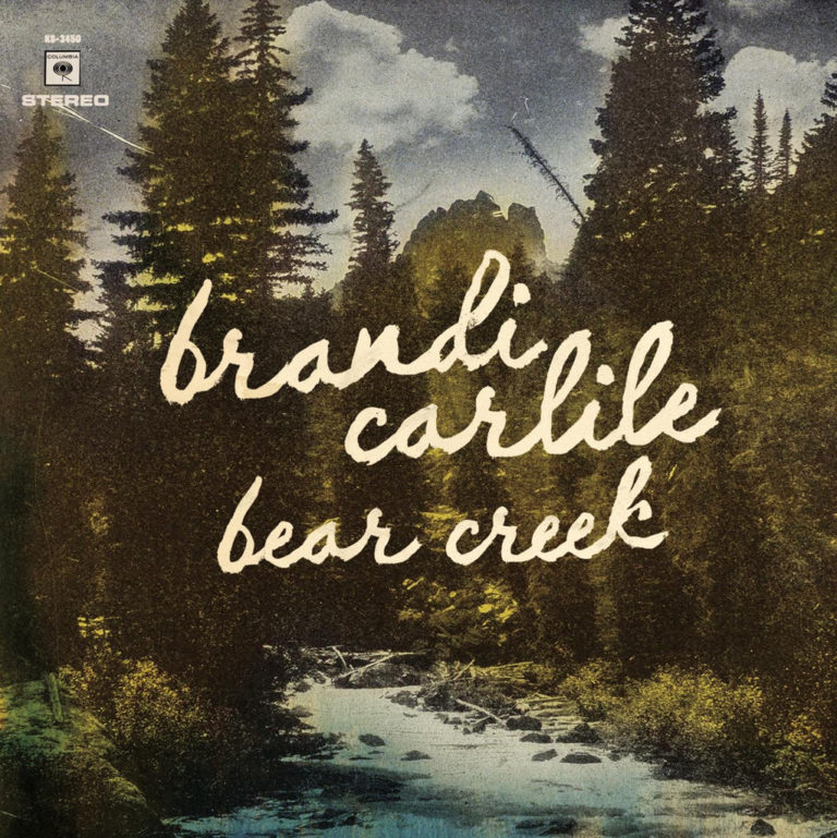 Waldlandschaft mit Fluss und handgeschriebenem Albumtitel.