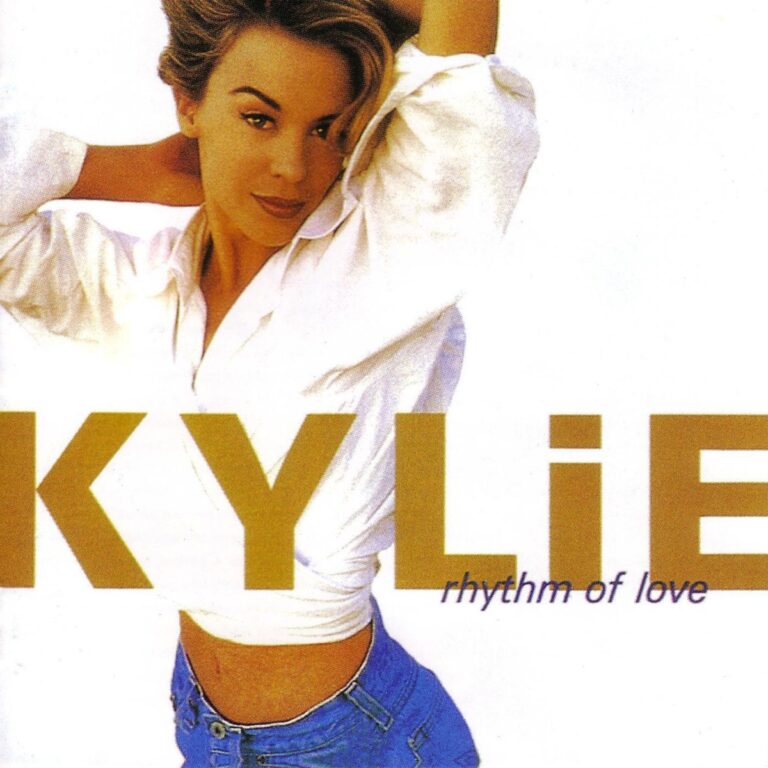 Albumcover von Rhythm of Love mit Kylie Minogue in einem weißen Oberteil und blauen Jeans.