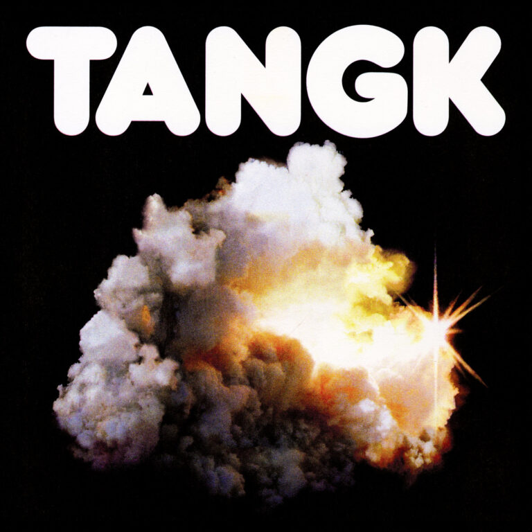 Albumcover von IDLES – TANGK: Vor schwarzem Hintergrund eine leuchtende, wolkenartige Explosion mit sternartigem Lichtblitz, darüber fett gesetzter Titel in weißer Schrift.