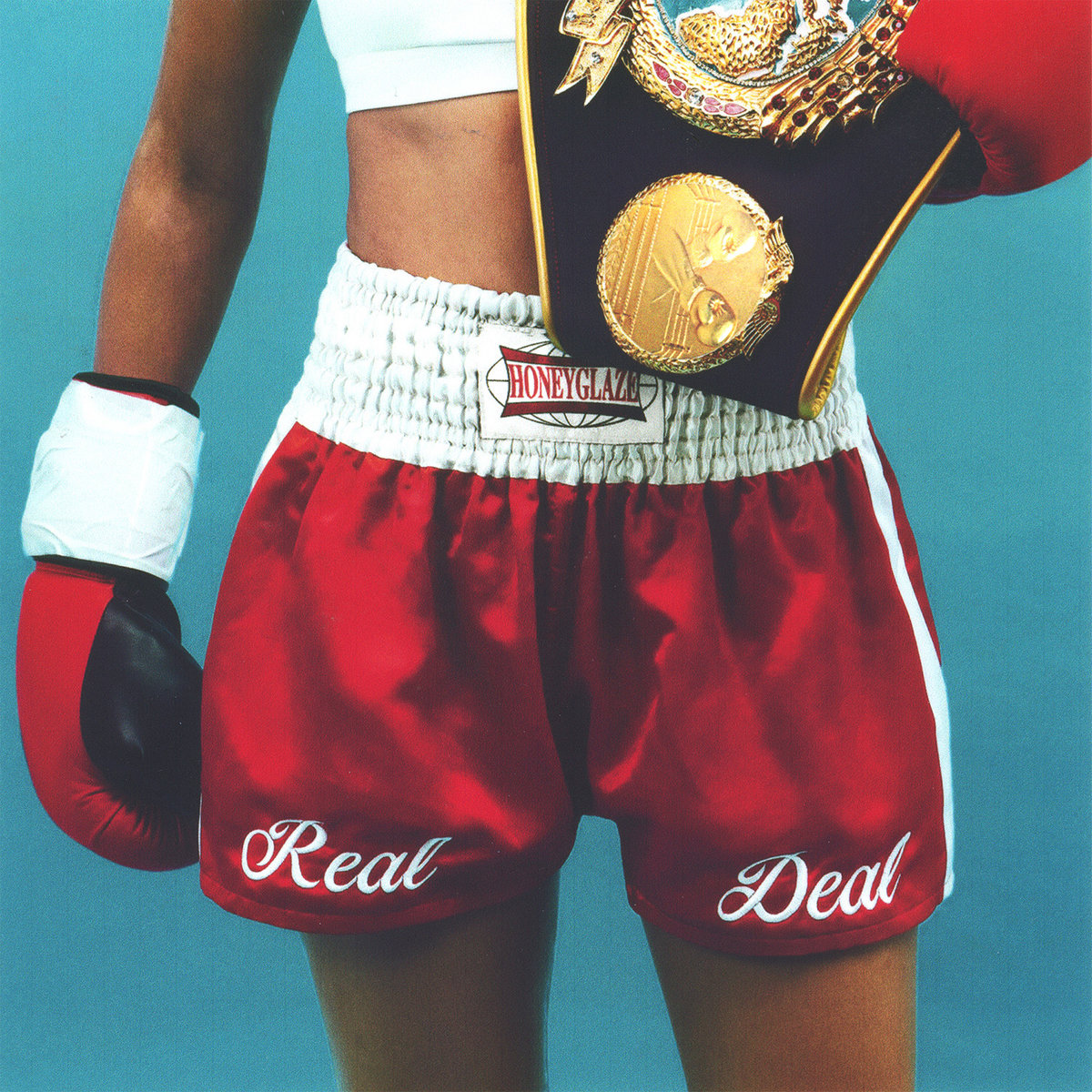 Albumcover zu "Real Deal" von Honeyglaze: eine Boxerin in roten Shorts mit Champion-Gürtel, stilvoll und kämpferisch inszeniert.