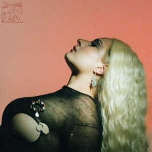 Låpsley mit platinblondem Haar, im Profil nach oben blickend; trägt ein transparentes schwarzes Top vor rot getöntem Hintergrund – Artwork zu „Better“.