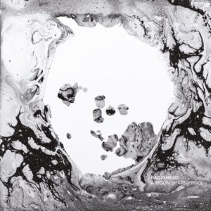 Abstraktes Schwarzweiß-Albumcover von A Moon Shaped Pool von Radiohead, zeigt fließende, marmorierte Strukturen, die einen weißen, leeren Raum umrahmen – zwischen organischem Chaos und meditativer Leere.